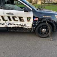 <p>An officer was injured after a car struck two police cruisers, causing one to hit the officer.</p>