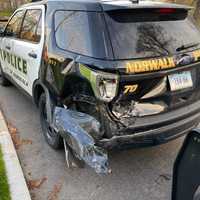 <p>An officer was injured after a car struck two police cruisers, causing one to hit the officer.</p>