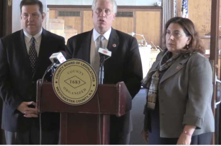 Legislators Jim Maisano, Michael Kaplowitz and Catherine Borgia discuss the postponement of a vote on the Immigrant Protection Act until August 7.