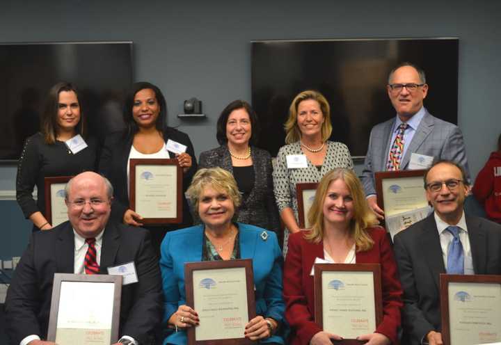 Seated, from left, Ted Zink, Jr., Susan Mills Richmond, Wendy Marie Weathers, Nathan Horowitz; standing, from left, Natasha Meruela, Deyanira Gonzalez, Marian Genio, Dawn Kirby, and Hugh Rothbaum. Julie Cvek Curley, not pictured.