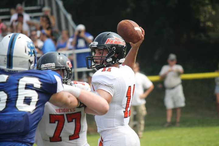 Quarterback Frank Quatrone looks to pass in the season opener against St. Mary, Rutherford.