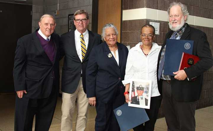 President Cliff Wood and Board of Trustees Chair Martin Wortendyke present Arlene Clinkscale, Roxanne Watson, and Greg Wyatt with awards for outstanding progress.