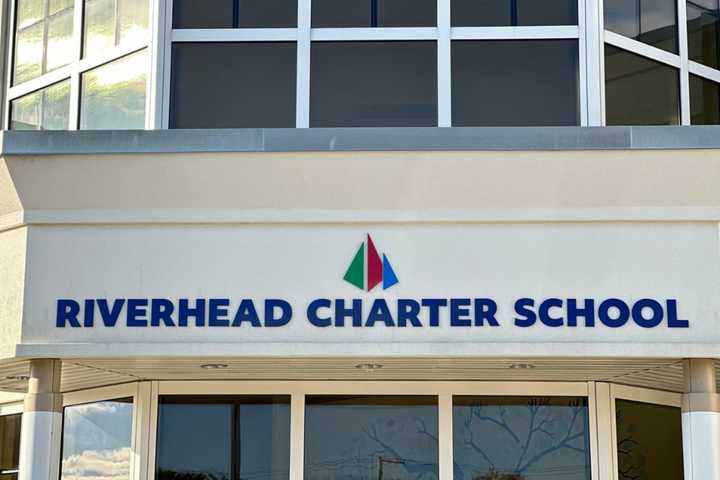 A 14-year-old was arrested after posting a bomb threat at Riverhead Charter High School on social media, police said.&nbsp;