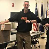 <p>Matt Taylor of RISE (left) delivers care packages to Deputy Chief Ed Podgorski to support Stamford EMS emergency response workers.</p>