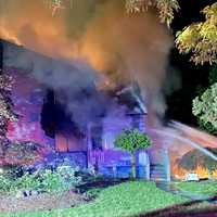 <p>The overnight fire in River Edge apparently began in the attached garage and quickly spread to some vehicles and through one end of the two-story, 3,500-square-foot wood-frame house.</p>