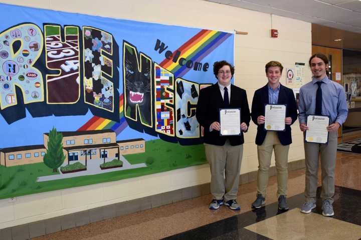 Rye Neck High School students Gabriel Miller, Owen Robertson, and Sean Diamond received proclamation awards for theirresearch on public perceptions of water quality.