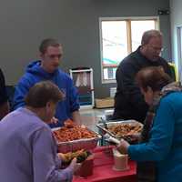 <p>(l. to r.) Sgt. William Junior Police Academy Intern Michael Affrunti, Officer John Guglielmotti, Chief William Giordano, and Detective Sergeant John DeVoe serve food to the members of the Senior Friendship Club.</p>