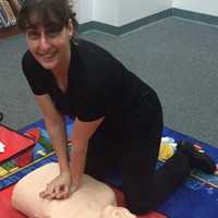 <p>Randi Colton performing CPR on a mannequin.</p>