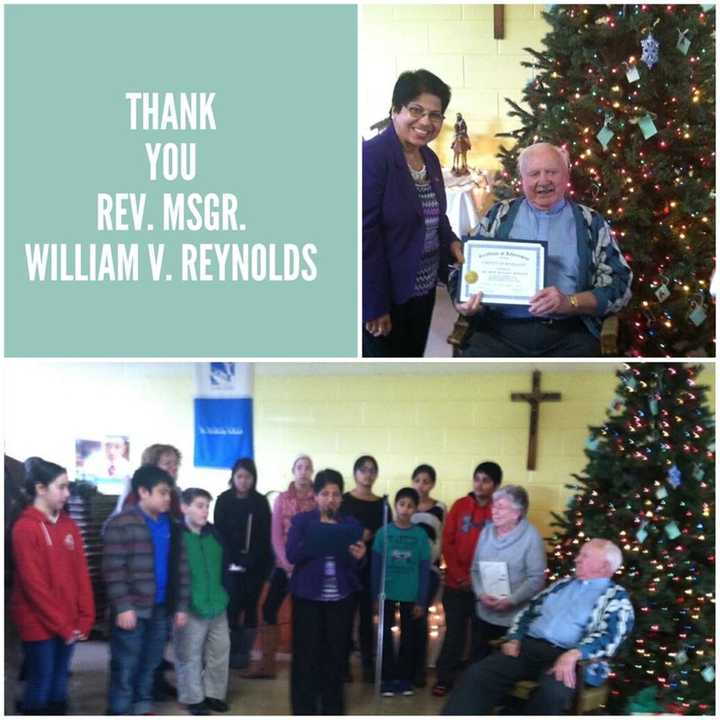 Top photo: Rockland County Legislator Aney Paul presents Rev. Msgr. William V. Reynolds with a certificate of appreciation to acknowledge his tenure and his many contributions to the community during a reception in the school cafeteria. 