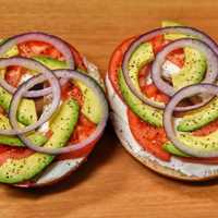 <p>Fresh is the word for the sliced onion, avocado, and tomatoes on Rhinebeck Bagel Café&#x27;s whole wheat bagel-based sandwich.</p>