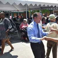 <p>Rob Astorino dances with one of the guests at the Westchester annual senior pool party/barbeque in White Plains.</p>