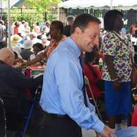 <p>Rob Astorino talks with some of the guests at the Westchester annual senior pool party/barbeque in White Plains.</p>