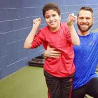 <p>Russ Van Ness poses with one of his clients.</p>