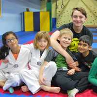 <p>Ryan Kennedy poses with some of his students at Sensory Taekwon-Do in Waldwick.</p>