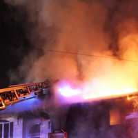 <p>Heavy flames in the attic quickly blew through the roof and raced through the Nicholas Court home in Saddle Brook.</p>