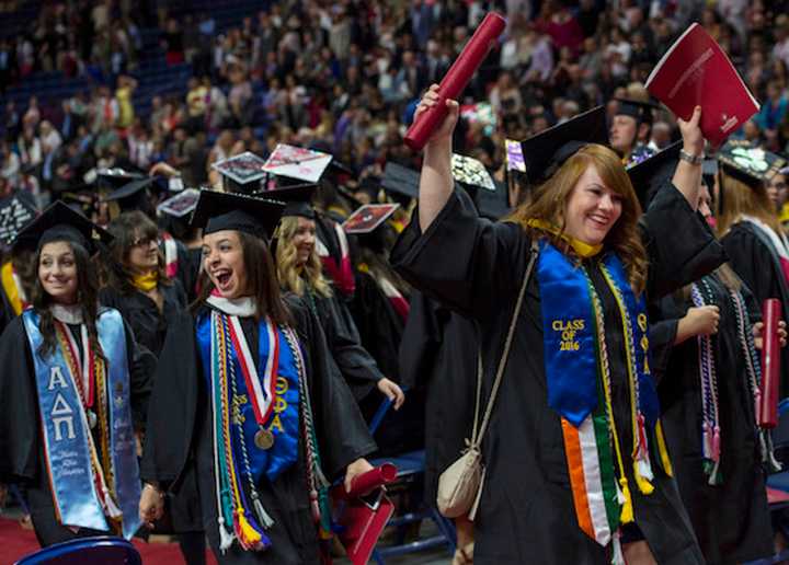 Graduates cheer at Sacred Heart University&#x27;s undergraduate commencement exercises on May 15 at the Webster Bank Arena in Bridgeport.