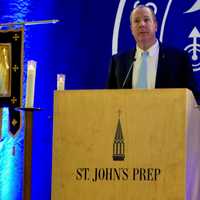 <p>St. John’s Prep Head of School Dr. Ed Hardiman delivers a call to prayer at a service for sixth-grade student Sebastian Robinson on Thursday evening, Feb. 9</p>