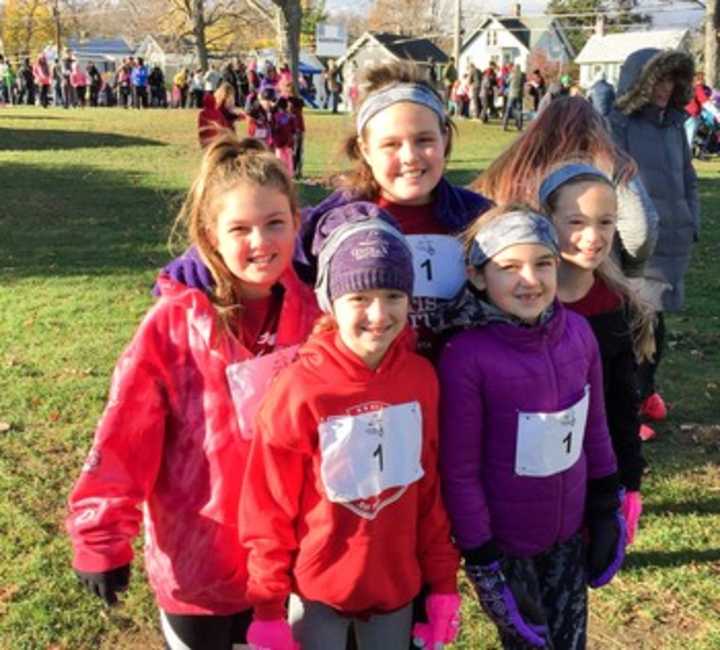 Students from Woodglen Elementary ran across the finish line Nov. 14, marking their completion of a three-month-long program &quot;Girls on the Run&quot; aimed at teaching young girls the skills they need to succeed in life.