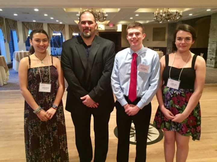 Chris Graziano (second left), vice president of SUEZ operations in New York, with SUEZ-NAWC scholarship winners Jessica Minker of North Rockland High School, Daniel Henry of Tappan Zee High School and Caitlin Holt of Pearl River High School.