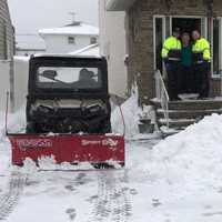 <p>Andrew Ralicki, 15, shovels snow in Saddle Brook for a senior citizen. The senior is flanked by Saddle Brook Police Chief Robert Kugler and Mayor Robert White.</p>