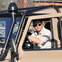 <p>Mike Sandone in his Land Rover: He is a cave explorer described as “Monroe’s Indiana Jones.”</p>