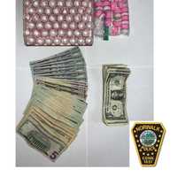 <p>The drugs and cash seized.</p>