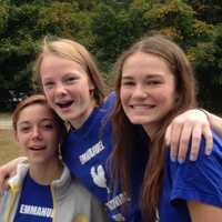 <p>Emmanuel’s teen parishioners, Grace Juneau, Lily Butt and Claire Magee, from left, at last year’s fair in Weston.</p>