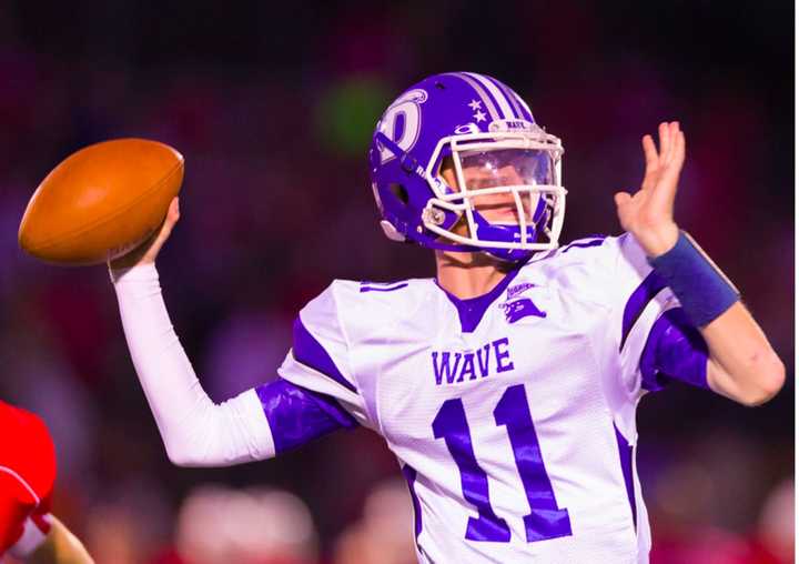 Darien High School quarterback Tim Graham leads the Blue Wave to the state championship game next week. 