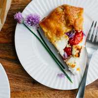 <p>Tomatoes, leeks and cheese combine to make a light, but flavorful, tart.</p>