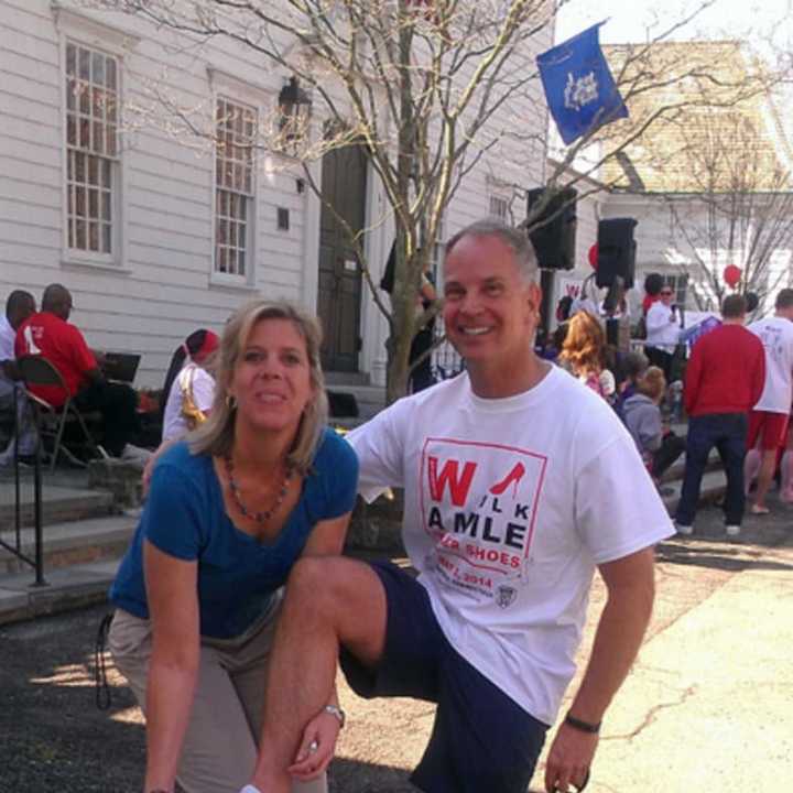 Participants in a previous Walk A Mile In Her Shoes event in Fairfield show off their shoes 