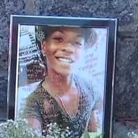 <p>A photograph of Tahj Robinson was part of an impromptu memorial set up near Barnhart Park by friends of the slain teen.</p>