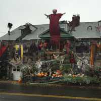 <p>Maria Bruno&#x27;s home on St. Roch Avenue in Greenwich almost disappears behind the Halloween decorations.</p>