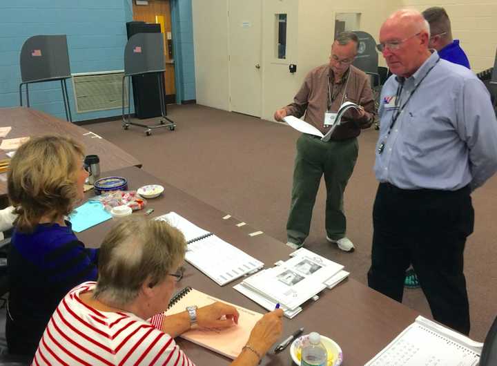 Poll workers in Dutchess County where turnout was high and steady on Tuesday. Polls close at 9 p.m.