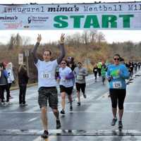 <p>Runners hit the finish line at Mima&#x27;s Meatball Mile for MSA Sunday in Danbury. </p>