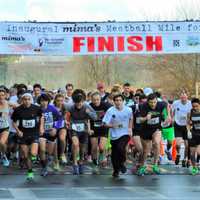 <p>Runners break from the starting line at Sunday&#x27;s Mima&#x27;s Meatball Mile for MSA in Danbury. </p>