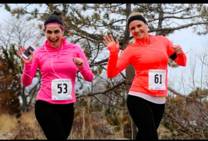 Two women have a fun time at a previous Jingle Bell Jog. The 3-mile race starts Sunday in Greenwich at 9 a.m. 