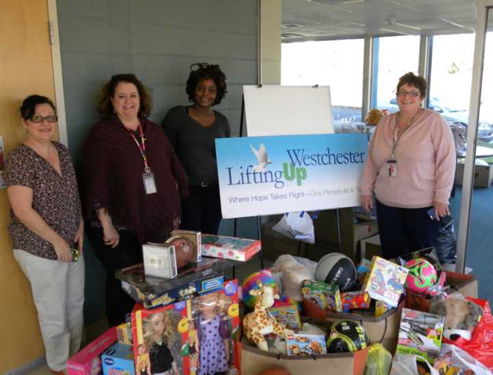 Berkeley College collected 137 toys for children at Lifting Up Westchester, which is based in White Plains. See story for IDs.