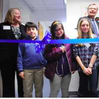 <p>Official ribbon cutters from left, front row, Wesley Elkind, Louisa Knapp, Molly and Katie Hayes, wait for Stamford Mayor David Martin to say the word as Linda Talbert, and Dennis Perry look on.</p>