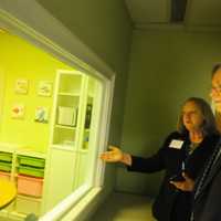 <p>Linda Talbert, Abilis’ Chief Program Officer of Therapeutic and Family Advisory Services and Stamford Mayor David Martin in the observation room adjacent to a therapy room at The Therapy Center at Abilis facility on Summer Street in Stamford.</p>