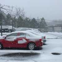 <p>A snow covered Greenwich Library parking lot.</p>