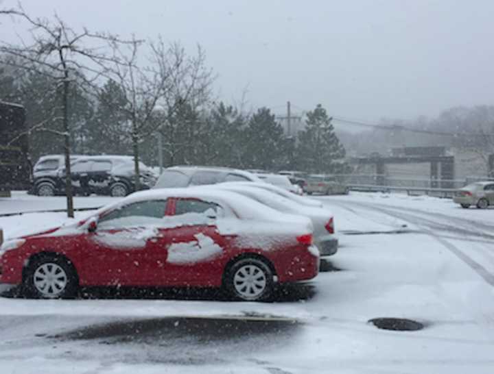 A snow covered Greenwich Library parking lot.