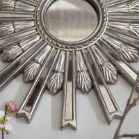 <p>Do a little reflecting and brighten up a drab wall at the same time. Our Deco-inspired Starburst mirror is hand-rubbed to an antique silver finish—and perfectly stunning.</p>