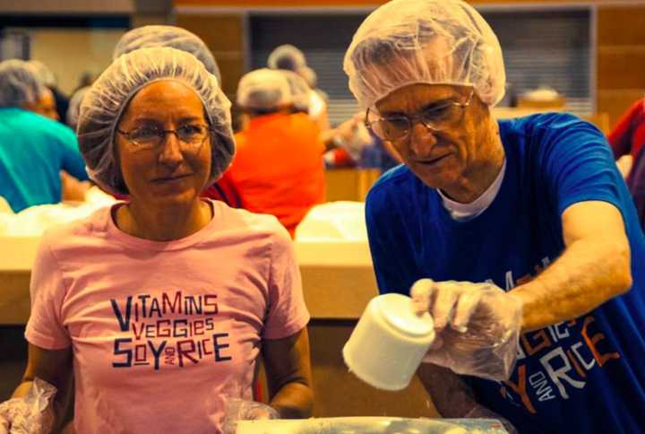 Help pack meals for underserved people at Pascack Hills High School.