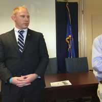 <p>Brookfield First Selectman Steve Dunn, right, speaks Friday while state Rep. Stephen Harding, R-107th District, looks on at a press conference urging residents to attend a Housing Committee hearing Tuesday in Hartford.</p>