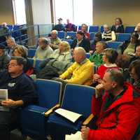 <p>Some of the attendees at a press conference Friday in Brookfield, at which local officials urged residents to attend a public hearing Tuesday in Hartford on a bill changing the affordable housing law.</p>