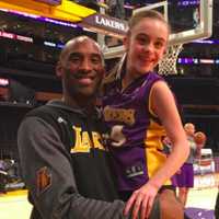 <p>Marina Pellicciari, 11, with her hero, Kobe Bryant.</p>