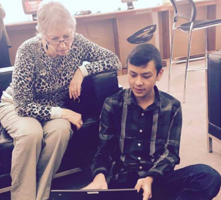 NMHS students teach seniors how to use technology at New Milford Senior Center.