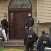 <p>FBI agents and police in the midst of one of their series of raids Wednesday afternoon in Rockland.</p>