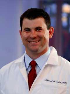 HSS Doctor Keeps Patients' Biceps Flexing