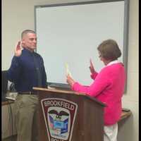 <p>Police officer Benjamin Gerstenmaier gets sworn into the Brookfield Police Department.</p>